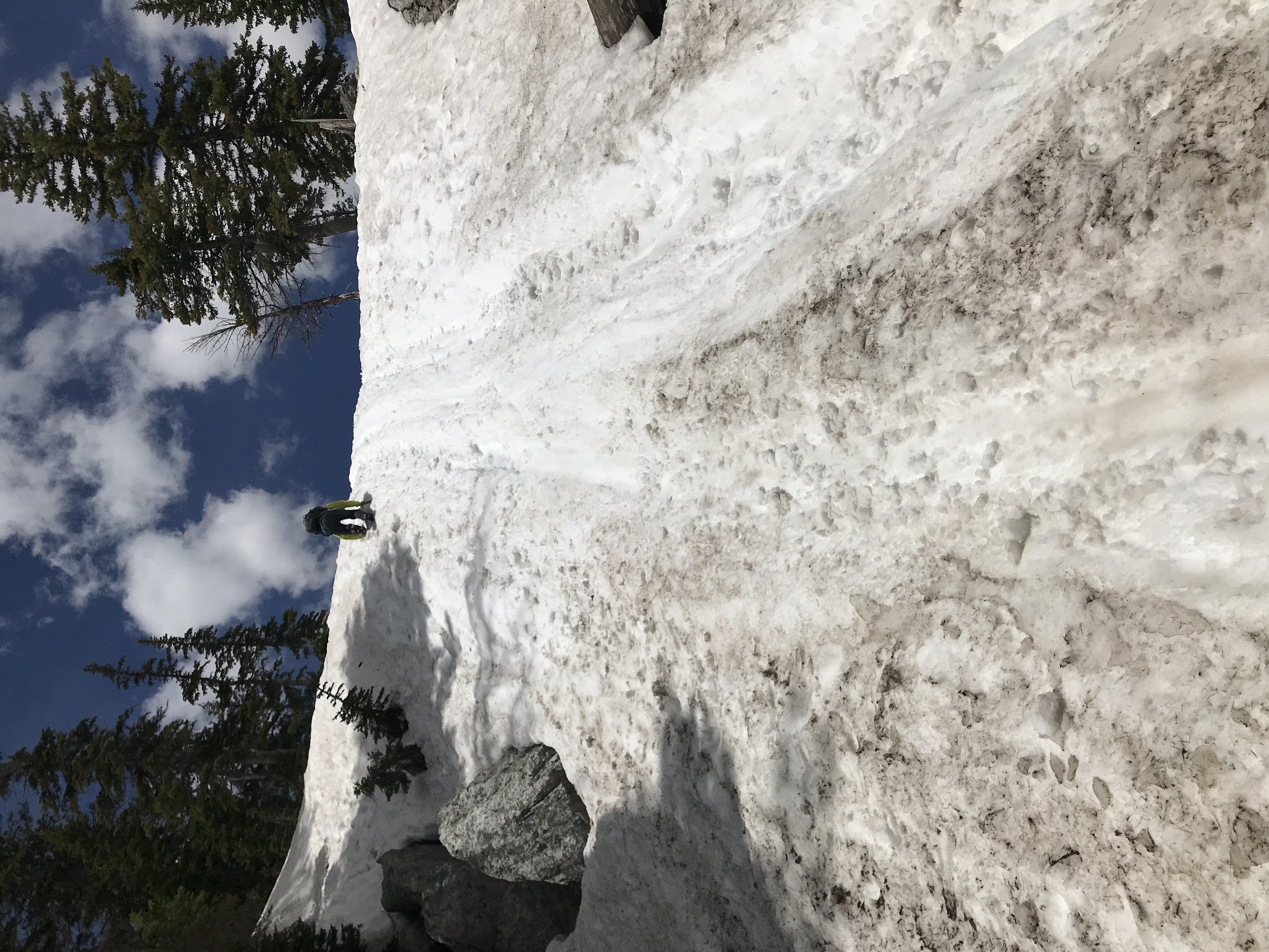 Climbing wall of snow to get to Delta Lake